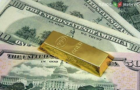 Золото снизилось в цене на фоне укрепления доллара США