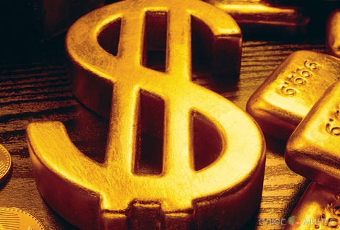 Слабый доллар вдохновил золото на рост